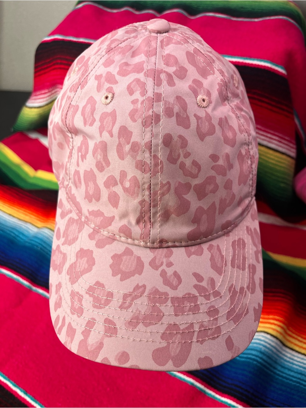 Rose colored Cheetah print messy bun hat